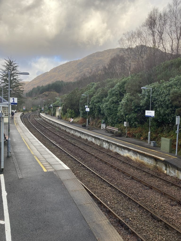 Rural Train Station at Glenfinnan, Scotland.  Mountain in the background.